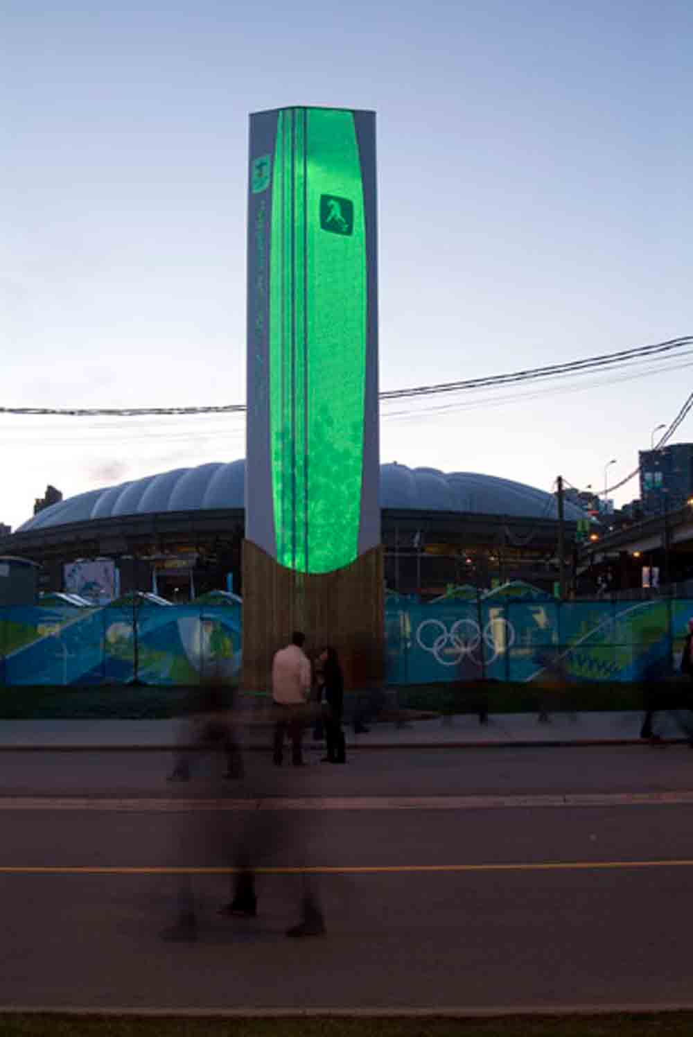 green lit wayfinding signage tower for 2010 Winter Olympic Games