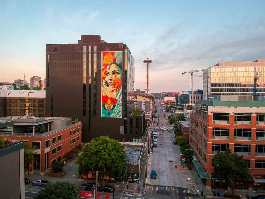 cityscape with large format printing mural by Shepard Fairey