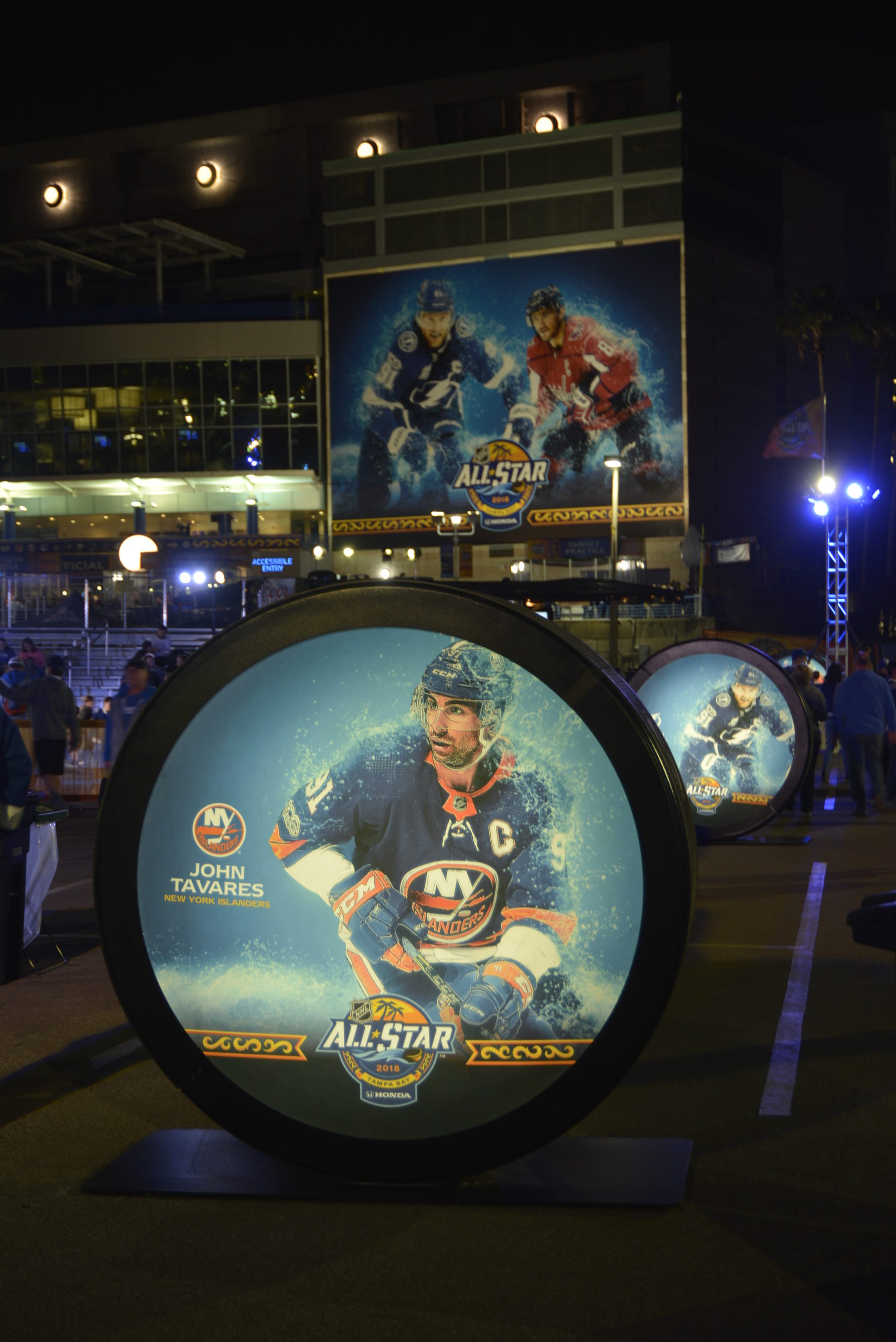 night shot of the light box hockey pucks for the nhl all star game