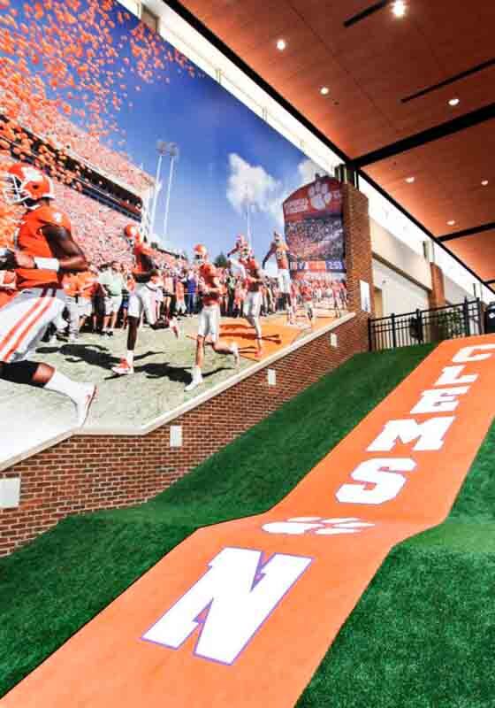 hallway with turf flooring and celebration wall mural for Clemson