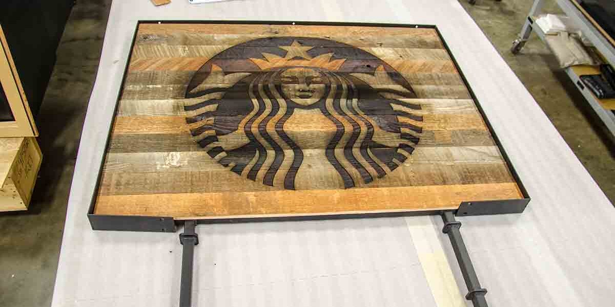 laser wood burning to make a Starbucks Coffee logo